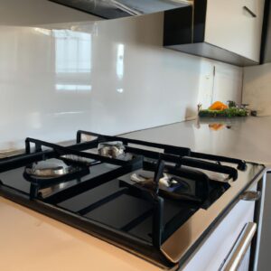 A stove top in a kitchen needing appliance repair services.