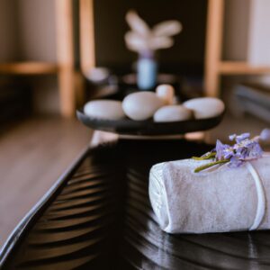 A white towel on a black tray at one of the top 5 massage therapists in Tauranga.